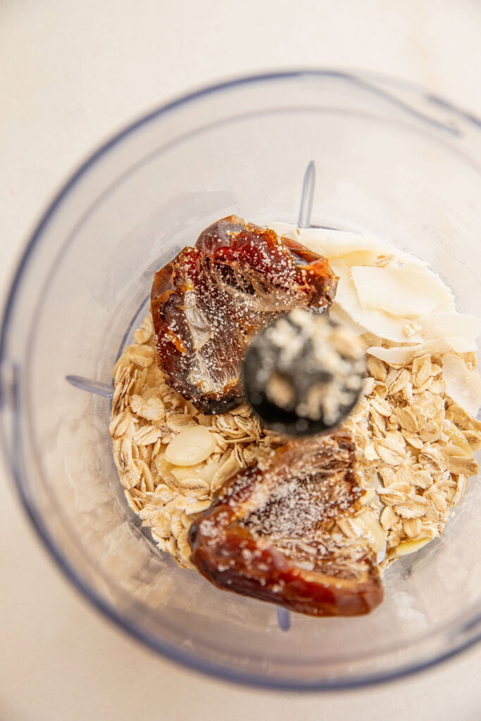 Blender cup with dates, oats, and coconut.
