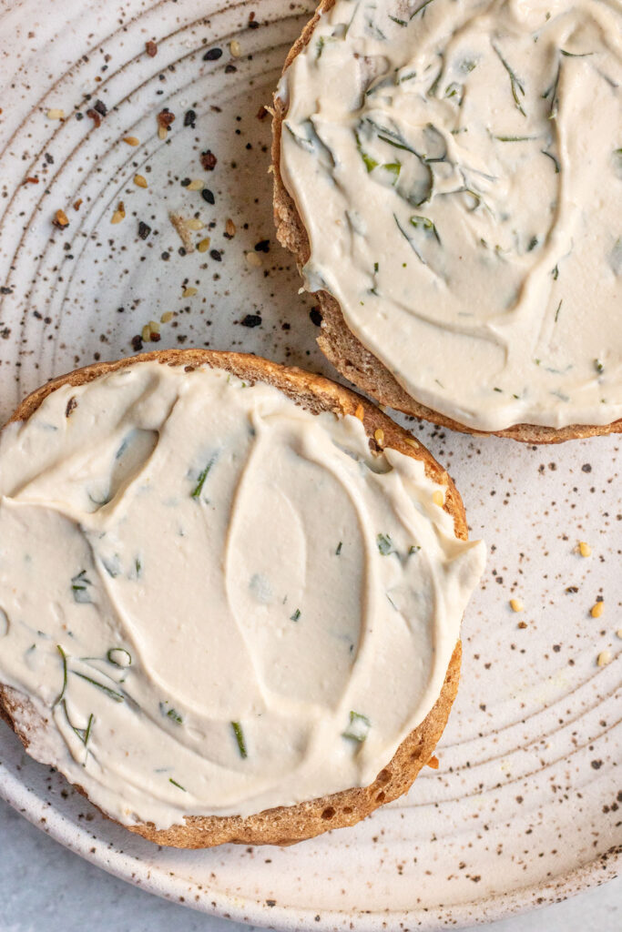 Bagels coated in vegan homemade cream cheese.