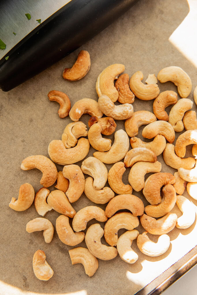 Roasted cashews on a tray.