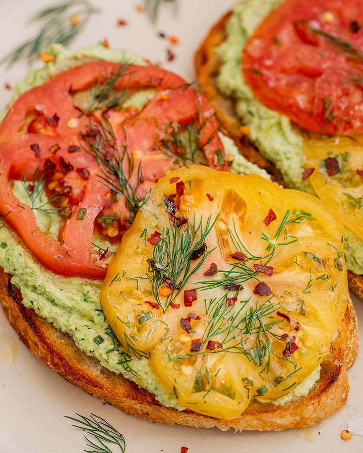 Marinated Tomato Toast with Garlic Dill Edamame Spread