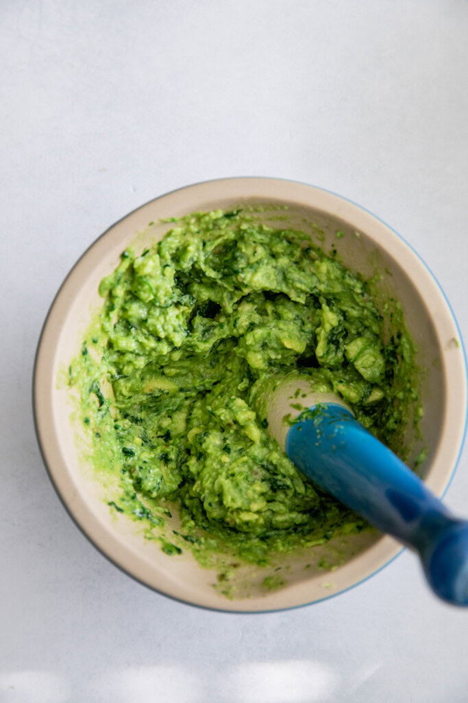 Mashed avocado in a bowl.