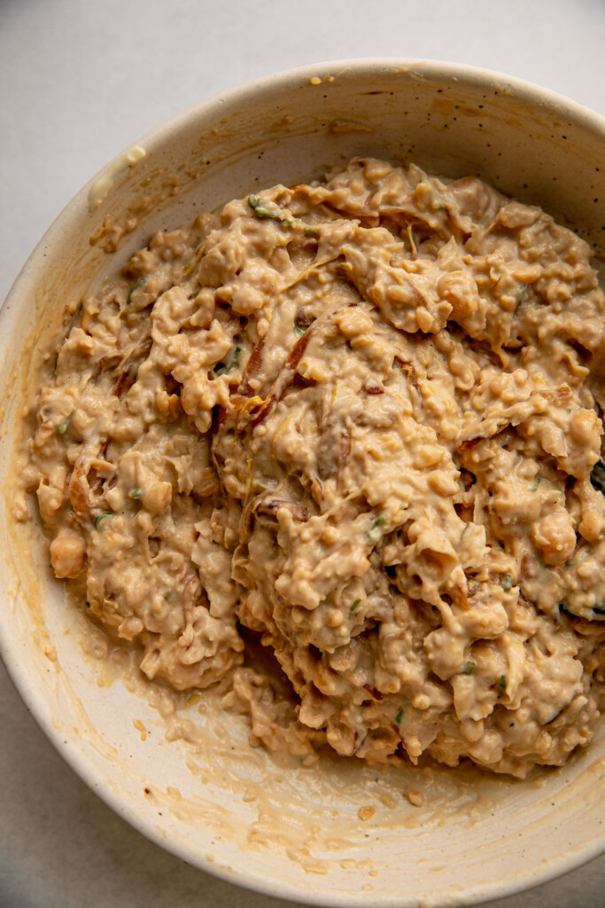 Chickpea salad mixture fully mixed in a bowl.