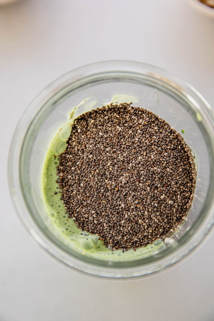 Adding the chia seeds to the matcha milk.