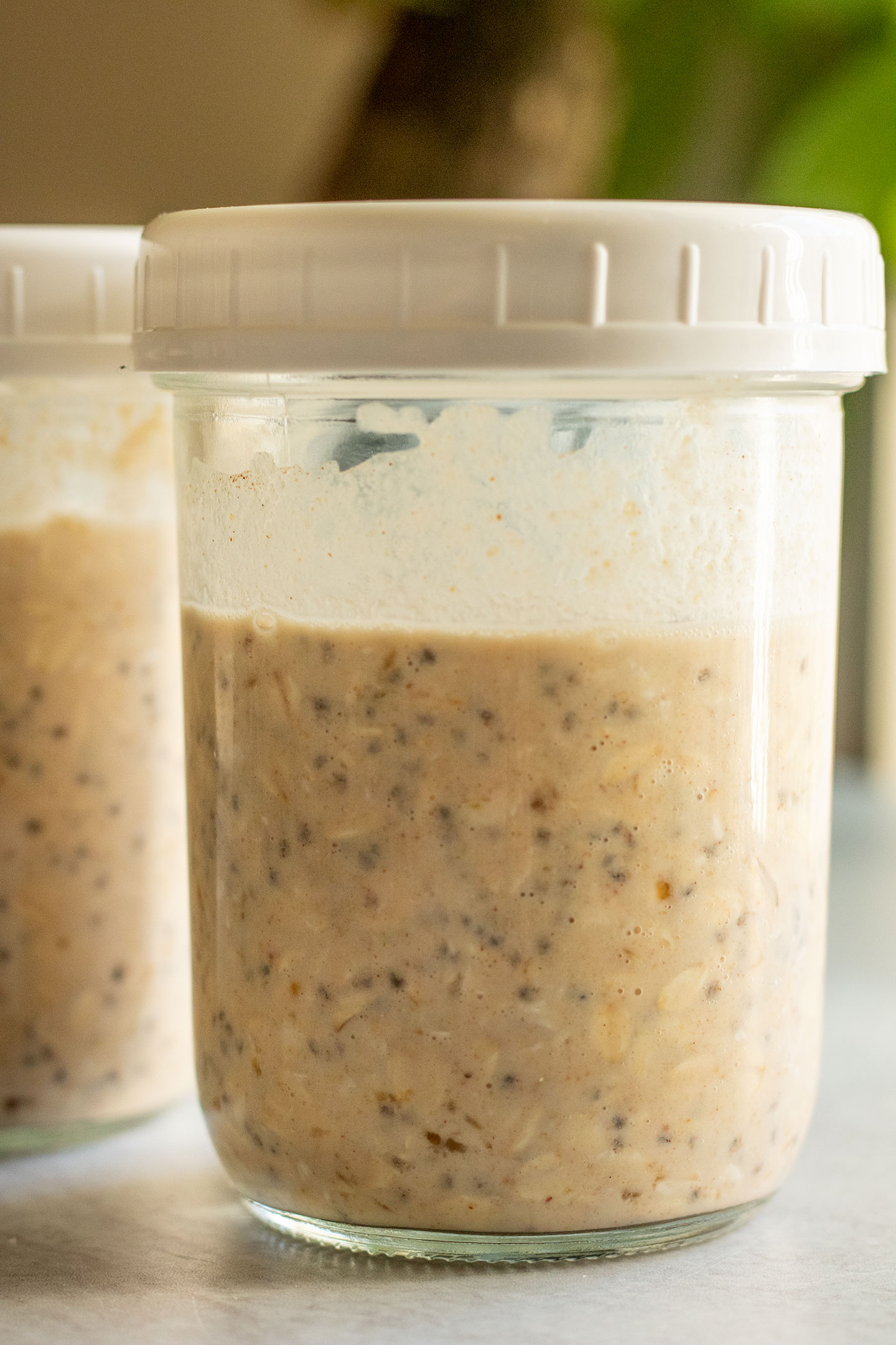 Sealing the jar after mixing the oats together.