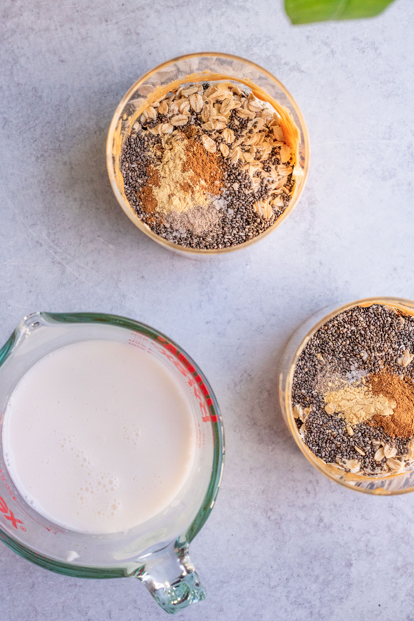 Mixing the dry ingredients into 2 jars with a measuring cup of milk to the side.