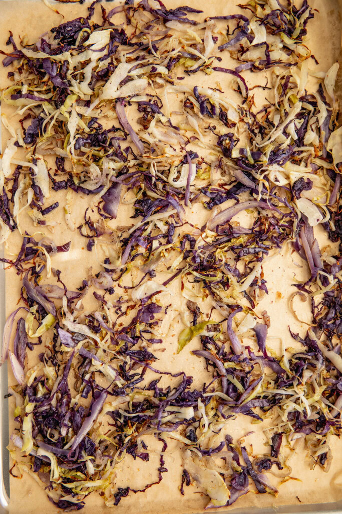 Roasted cabbage on a baking tray.