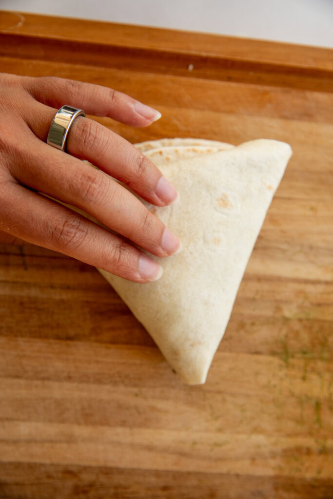 A fully folded wrap in the shape of a triangle.