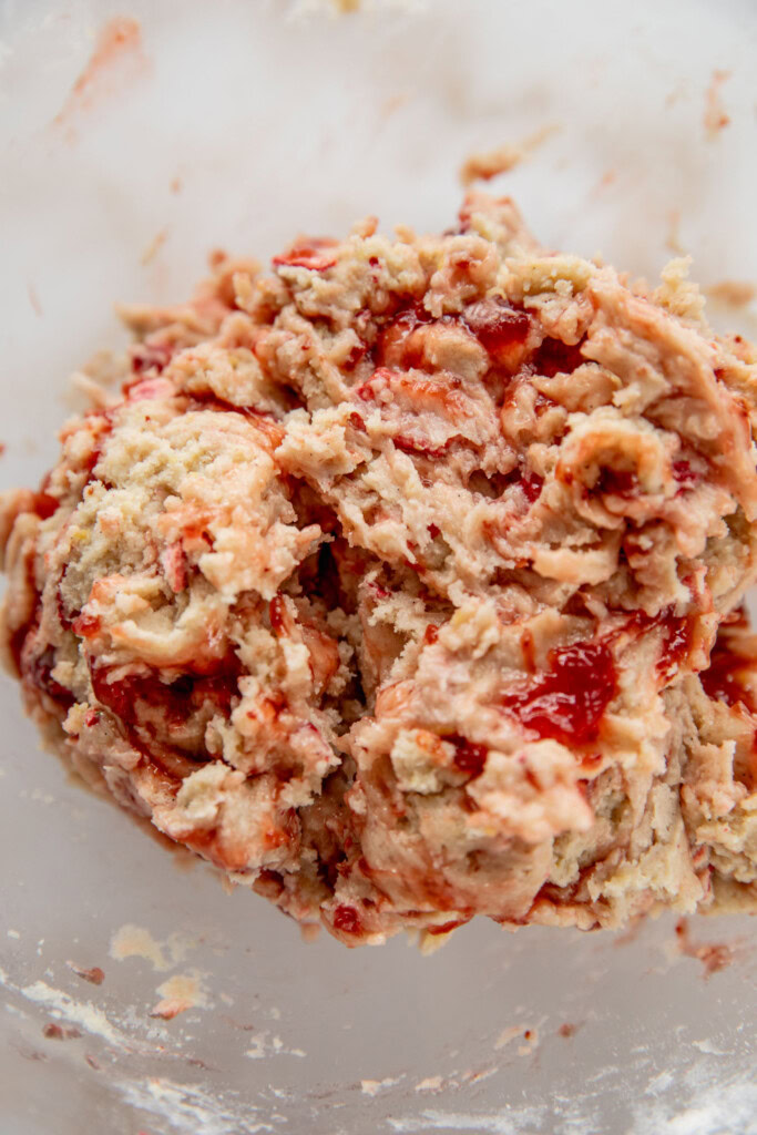 The jam being cut into the dough.